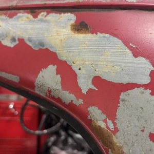 PatinaSource BrushedPrimer - Now I see how the prior owner got a "patina" look to truck. Top coat comes off easily. Undercoat is a brushed primer.